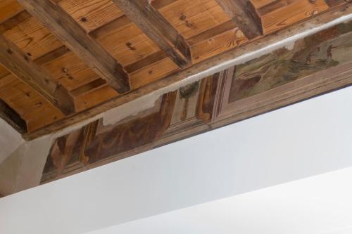 a close up of a ceiling with wood at Argentina Residenza Style Hotel in Rome