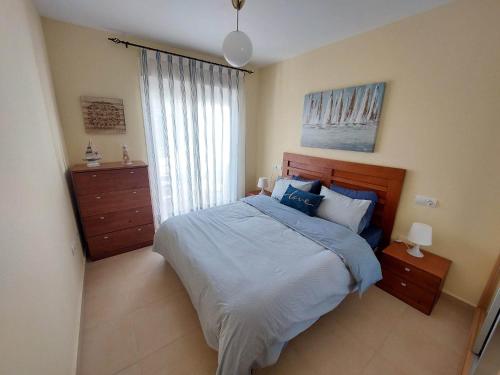 a bedroom with a large bed and a window at Casa Verso Vera Playa in Vera