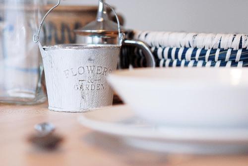 a cup sitting on top of a table with a bowl at LUX Ferienwohnung im Weinort Pommern an der Mosel in Pommern