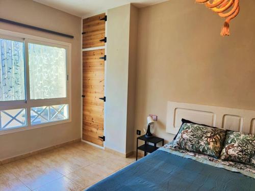Postel nebo postele na pokoji v ubytování Casa Burbuja Azul
