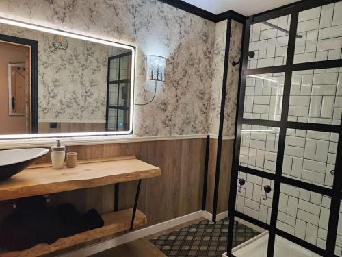 a bathroom with a sink and a mirror at Casa Burbuja Azul in Gran Tarajal