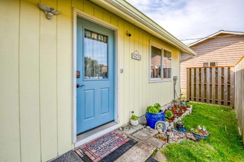 a house with a blue door and some plants at Shore Delight Waldport Home and Deck, Walk to Beach in Waldport