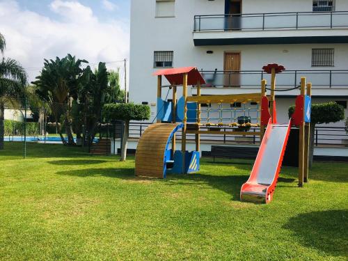 un parque infantil con tobogán en Apartment Casa Lila 100m from the beach, en Torrox Costa
