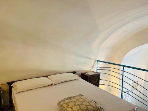 a bedroom with a bed with a pillow on it at Lunatica Immobilevante in Ponza