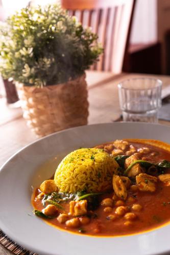 a plate of food with beans and rice on a table at Pure Magic Lodge in Slievemore