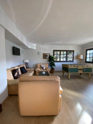 a living room with a couch and a table at Hotel Tirol in Formigal