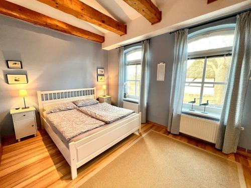 En eller flere senge i et værelse på Ferienhaus Schlossstraße