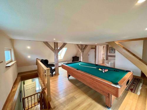 a living room with a pool table in it at Ferienhaus Schlossstraße in Kühlungsborn