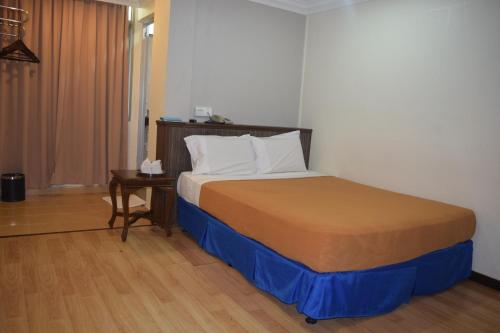 Katil atau katil-katil dalam bilik di Federal Hotel Kangar Perlis