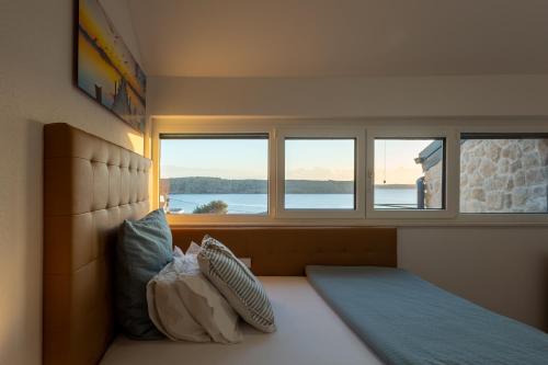 Postel nebo postele na pokoji v ubytování Rtina Appartements
