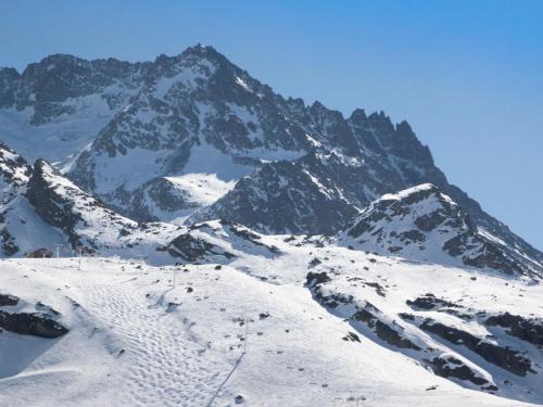 a snow covered mountain with a snow covered mountain at Apartment Trois Vallées 516 by Interhome in Val Thorens