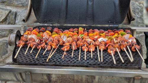 a bunch of chickens and other food on a grill at Blackhouse Bothies in Balallan