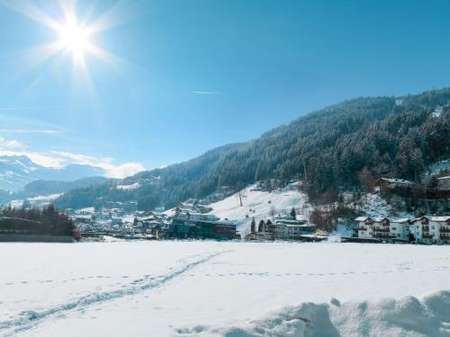 a view of a town in the snow at Apartment Monika-1 by Interhome in Gattererberg