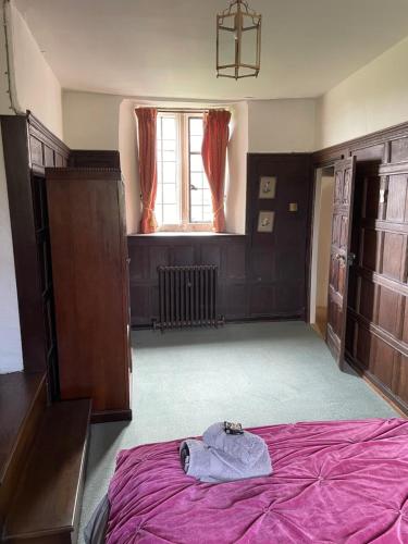 Postel nebo postele na pokoji v ubytování Higher Melcombe Manor