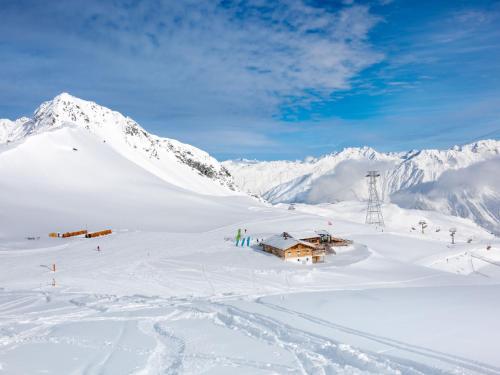 a ski lodge in the snow in the mountains at Apartment Promenade Wohnung 21 by Interhome in Davos