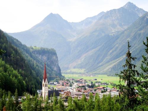 a town in a valley with mountains in the background at Apartment Falkner-7 by Interhome in Oberlängenfeld