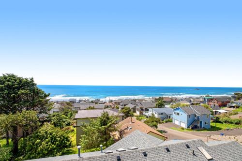an aerial view of a town with houses and the ocean at Soaring High in Lincoln City