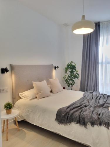 A bed or beds in a room at Residencial de la Yedra