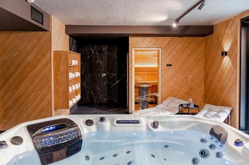 a jacuzzi tub in the middle of a room at Lipowy Dwór in Zakopane