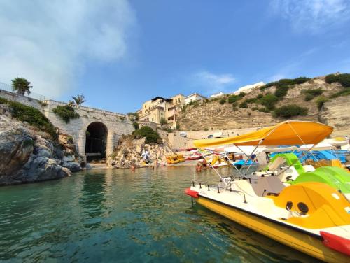 a group of boats docked in a body of water at B&B San Vito in Tricase