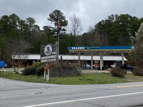 a walmart gas station with a sign in front of it at JI11, Queen Guest Room at the Joplin Inn at the entrance to Mountain Harbor Resort Hotel Room in Mount Ida