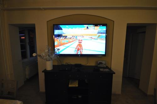 a television with a video game on it in a room at Wellness Pension Fulda Černý Důl in Cerny Dul