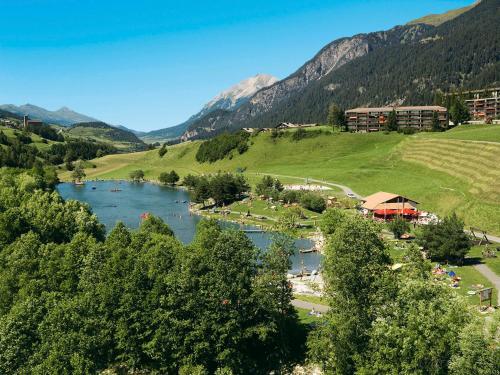 a view of a river with mountains in the background at Apartment Surses Alpin-2 by Interhome in Savognin