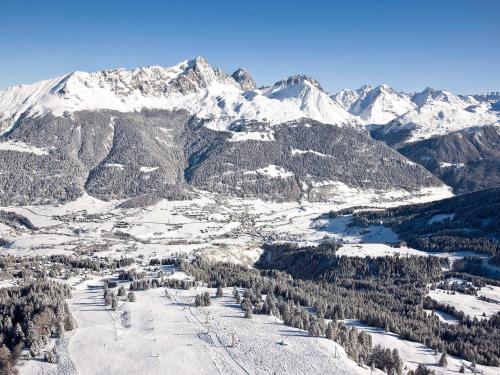 an aerial view of a ski resort in the mountains at Apartment Surses Alpin-1 by Interhome in Savognin