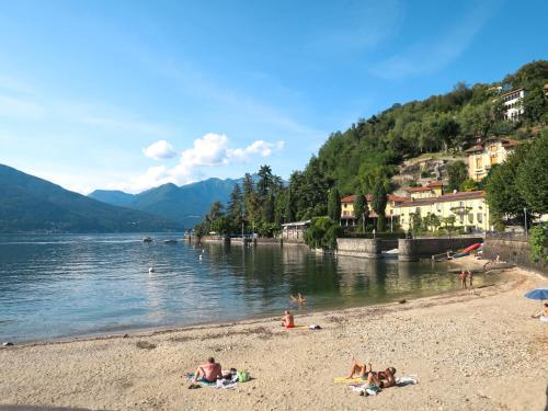 a group of people on a beach near a body of water at Holiday Home Daniela by Interhome in Luino