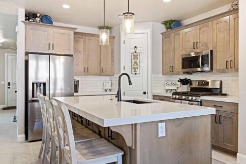 a kitchen with a large sink and a refrigerator at Escondido Cove in Washington