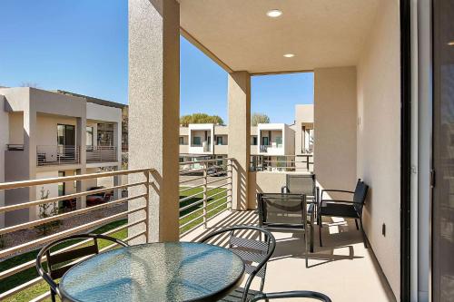 a balcony with a table and chairs on it at Get Away at the Lofts #24 townhouse in St. George