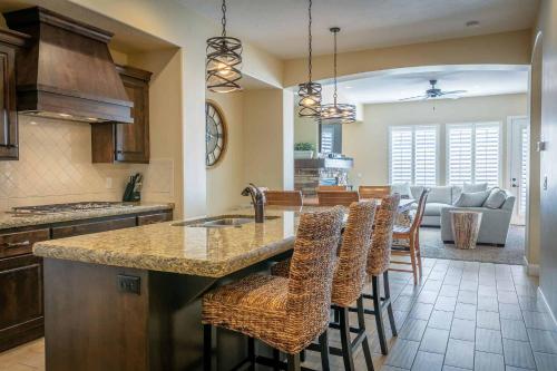 a kitchen with a island with bar stools at The Beach House townhouse in Washington