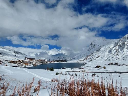 a lake in the middle of a snowy mountain at Apartment Rond Point des Pistes - Val Claret-17 by Interhome in Tignes