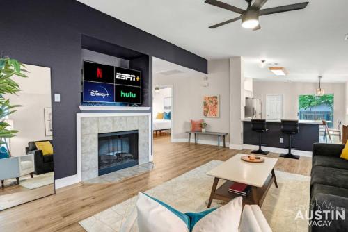 a living room with a couch and a fireplace at Cozy Home away from Home, Quiet Office, King Bed in Austin