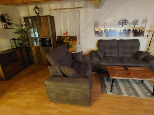 a living room with a couch and a coffee table at Holiday Home Holiday Hill 54 by Interhome in Cerny Dul