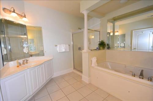 a large bathroom with a large tub and a sink at 332 Edgewater Villa in Myrtle Beach