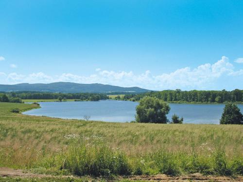a view of a large lake in a field at Holiday Home Dehtáře by Interhome in Hluboká nad Vltavou