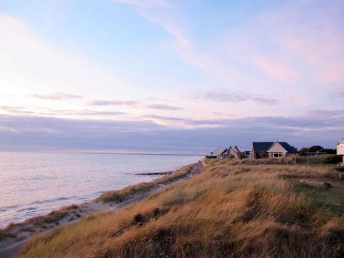a group of houses on the shore of the water at Holiday Home Le havre de paix by Interhome in Créances