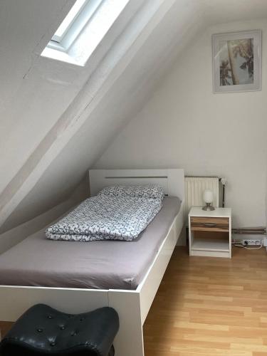 a bedroom with a bed in the attic at Unterkunft in Springe Zentrum in Springe