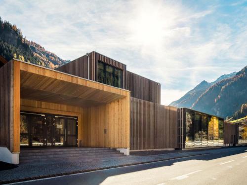 a building with mountains in the background at Apartment Top 1 by Interhome in Kaunertal