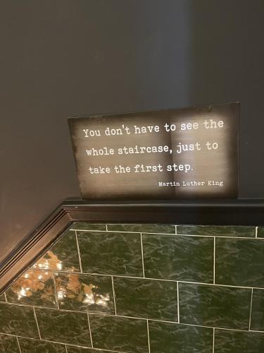 a sign on the top of a tile wall at The Twenty One in Brighton & Hove