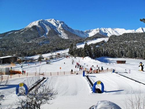 a group of people on a ski slope in the snow at Holiday Home Solea by Interhome in Imst