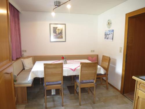 a dining room with a table and chairs at Apartment Am Schönbach - STA155 by Interhome in Sankt Jakob