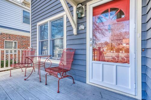a porch with a table and chairs and a door at Family Tides - 311 - 139th Street home in Ocean City