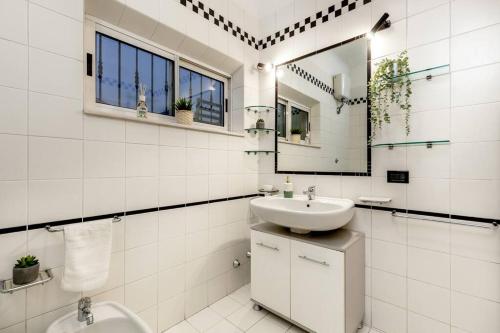 a white bathroom with a sink and a toilet at [500 mt. DAL MARE] WiFi Clima & Design in Porto San Giorgio