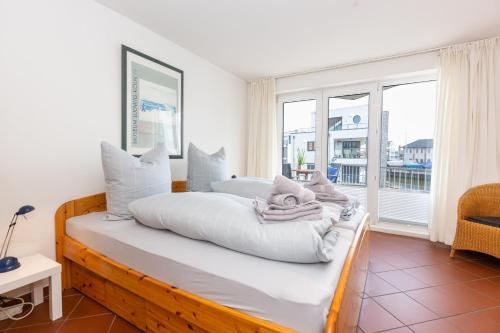 En eller flere senge i et værelse på Marina 28-1