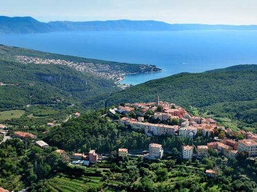 an aerial view of a town on a hill next to the water at Holiday Home Noel by Interhome in Raša