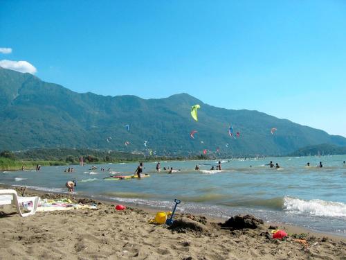 a group of people in the water at a beach at Apartment Pippo by Interhome in Masina