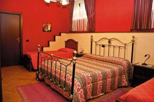 A bed or beds in a room at Aia di Lazzaro Agriturismo