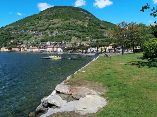 a body of water with a hill in the background at Apartment Aurora - DMA330 by Interhome in Vercana